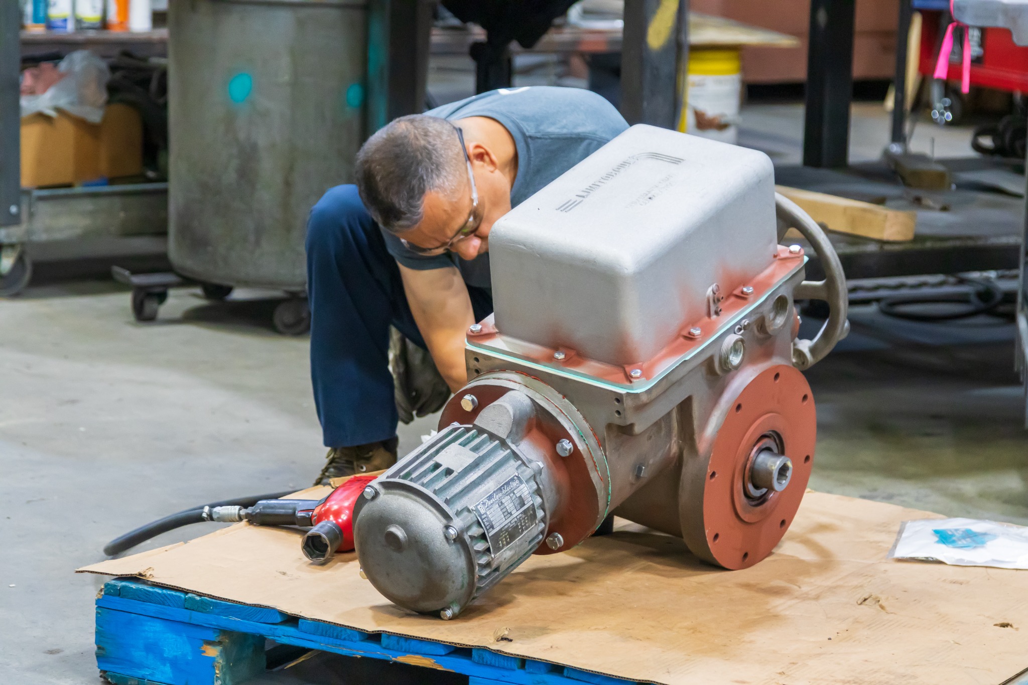 Georgia Western technician working on a valve actuator in the shop